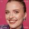 A close-up shot of a young woman with 90s thin eyebrows.