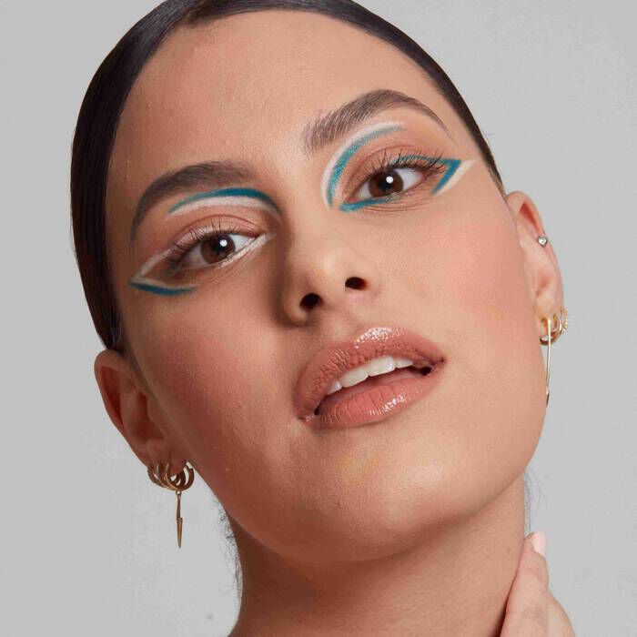 model wearing colourful eyeliner created using pencil liners