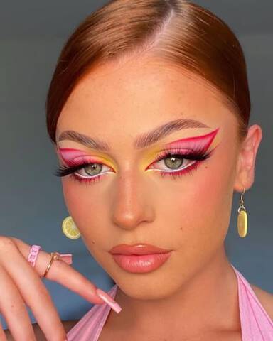 model wearing white eyeliner to make eyes appear bigger