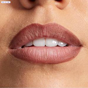 Close-up shot of a woman’s lipswith NYX’s Slim Lip Pencil applied.