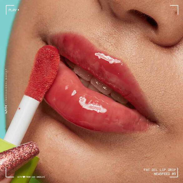 Close-up of model showcasing how to keep lips moisturised using NYX Fat Oil Lip Drip