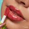 Close-up of model showcasing how to keep lips moisturised using NYX Fat Oil Lip Drip
