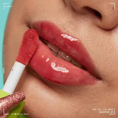 Close-up of model showcasing how to keep lips moisturised using NYX Fat Oil Lip Drip
