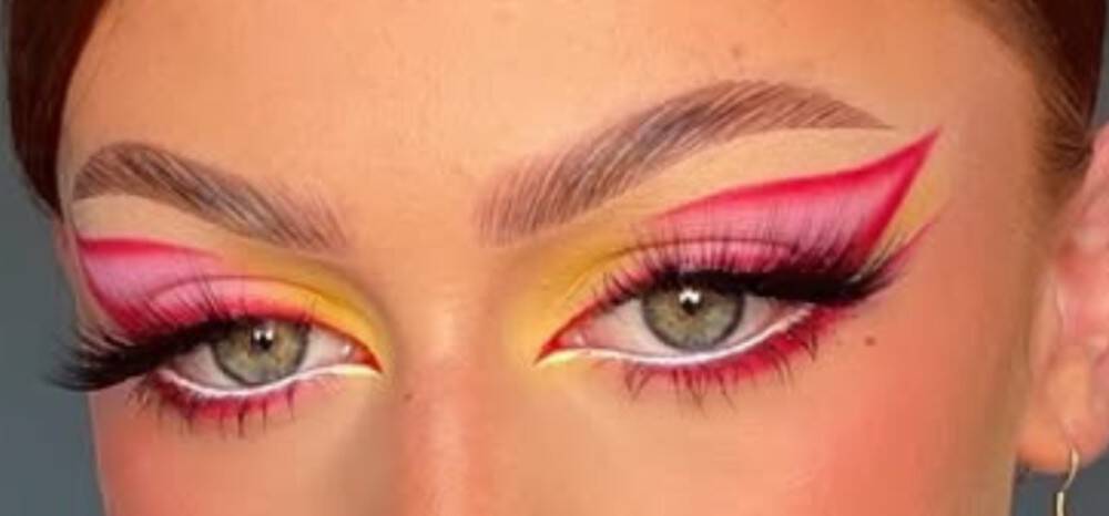model wearing white eyeliner to make eyes appear bigger