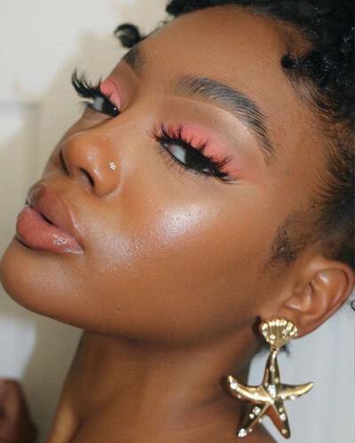 model wearing the Born to Glow foundation for dewy skin
