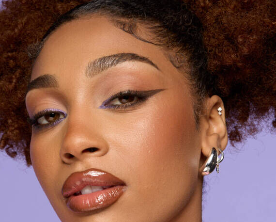 close-up of model’s face showcasing cat eyeliner look using pencil eyeliner