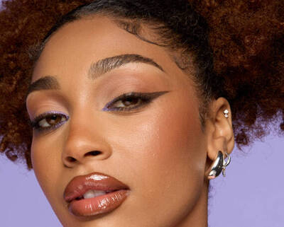 close-up of model’s face showcasing cat eyeliner look using pencil eyeliner