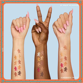 Features three arms with diverse skin tones, each displaying swatches of the eyeshadows from the NYX Professional Makeup Holiday Gingerbaddie Palette, illustrating how the colors appear on different complexions.