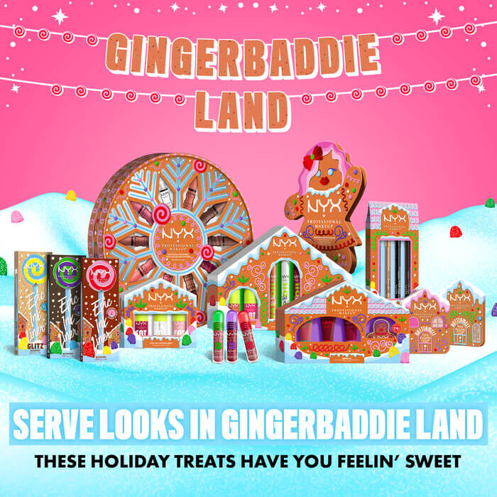 Displays a wider shot of the "Gingerbaddie Land" holiday collection, including the eyeshadow palette and other themed products within a festive gingerbread house and candy land setting, with the slogan "SERVE LOOKS IN GINGERBADDIE LAND."